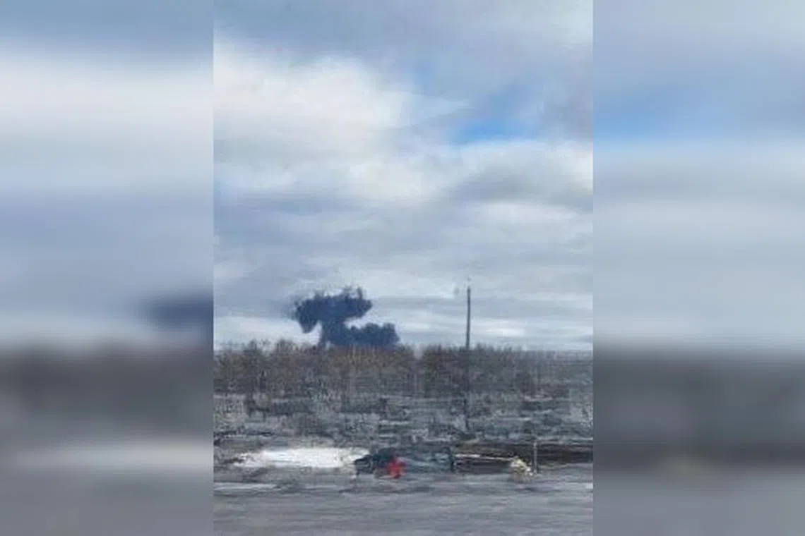Unverified videos on Russian social media networks showed a plane with one engine on fire heading downwards.