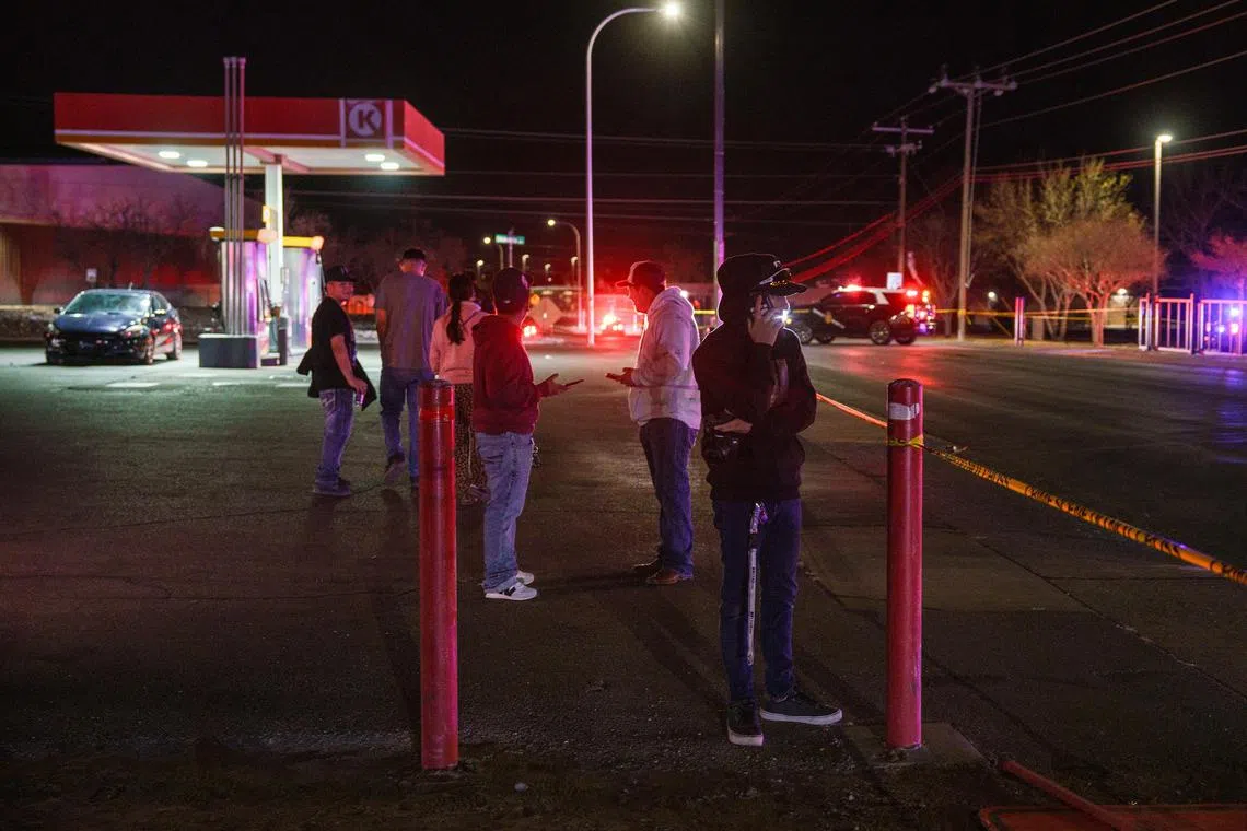 Witnesses near the scene of a shooting in Las Cruces, New Mexico, on March 22.