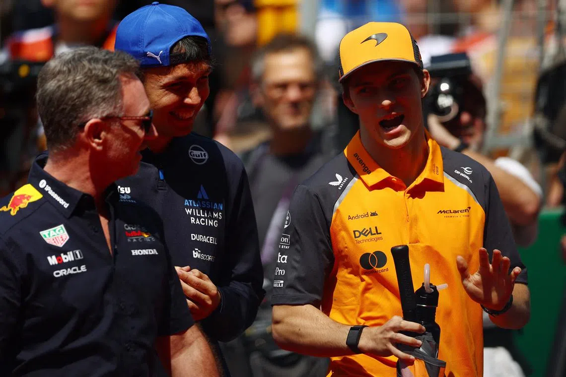 Formula One F1 - Chinese Grand Prix - Shanghai International Circuit, Shanghai, China - March 23, 2025 Red Bull team principal Christian Horner, Williams' Alexander Albon and McLaren's Oscar Piastri before the race REUTERS/Edgar Su