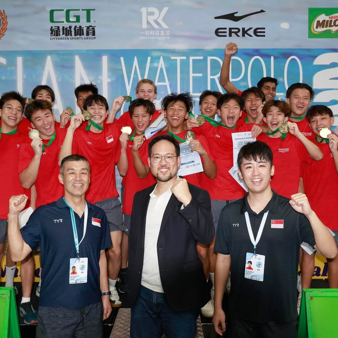 Singapore's U-18 water polo players with head coach Rio Shirahama (front row, right), assistant coach Kenta Shirahama (front row, left) and Singapore Aquatics president Kenneth Goh (front row, centre).
