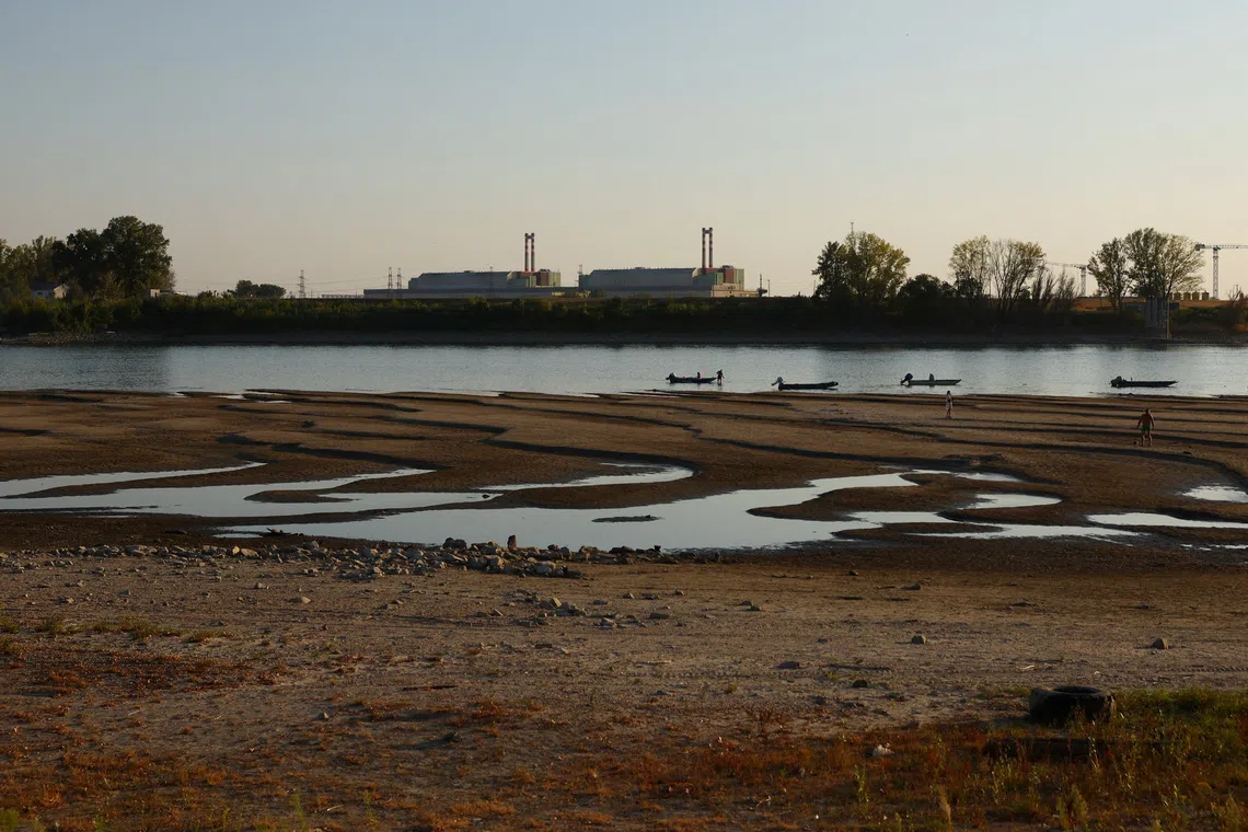 Paks Nuclear Power Plant with the partially dried-up Danube riverbed in Dunaszentbenedek, Hungary, July 31, 2026. REUTERS/Bernadett Szabo