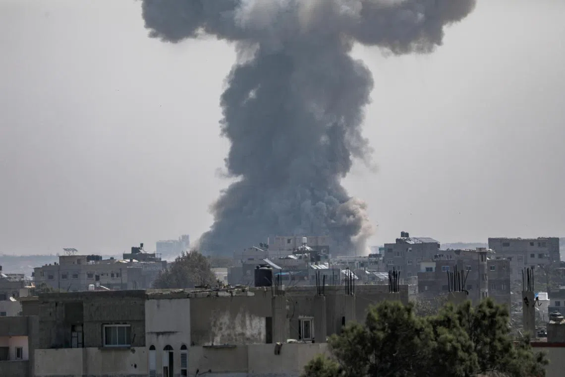 Smoke rises during an Israeli military operation at a refugee camp south of Gaza City on April 12.
