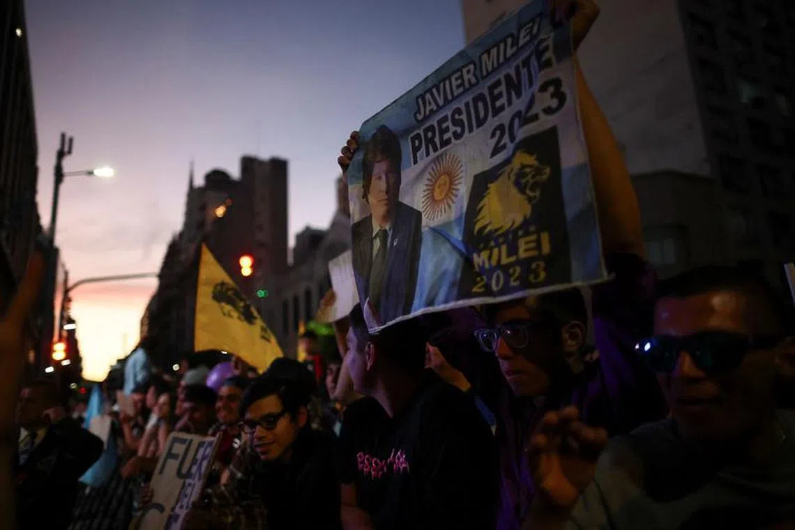 Supporters of Argentine presidential candidate Javier Milei, gather outside his campaign headquarters, during Argentina's runoff presidential election, in Buenos Aires, Argentina, November 19, 2023. REUTERS/Agustin Marcarian