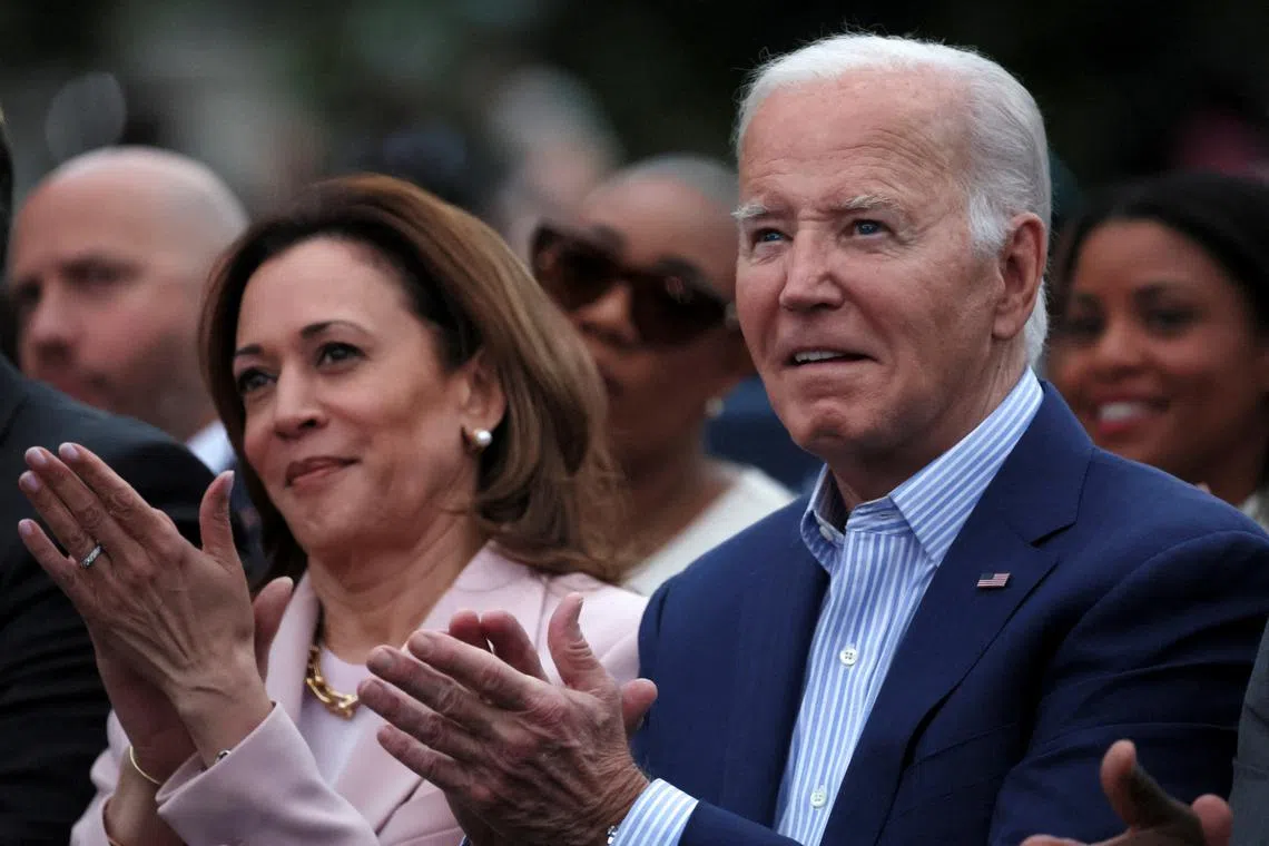 FILE PHOTO: U.S. President Joe Biden claps hands next to U.S. Vice-President Kamala Harris while hosting a Juneteenth concert on the South Lawn at the White House in Washington, D.C., U.S. June 10, 2024. REUTERS/Leah Millis/File Photo
