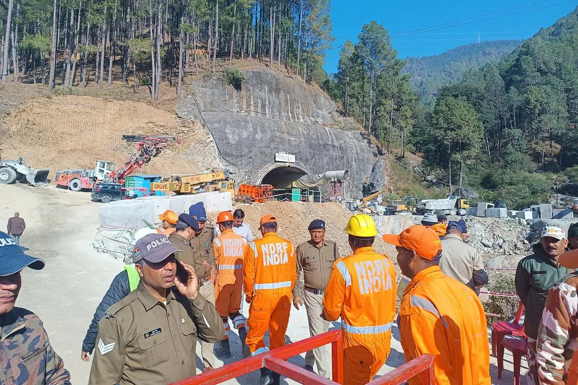 Rescue workers near the site of a tunnel collapse on the Brahmakal Yamunotri National Highway in Uttarkashi, India, on Nov 23, 2023.