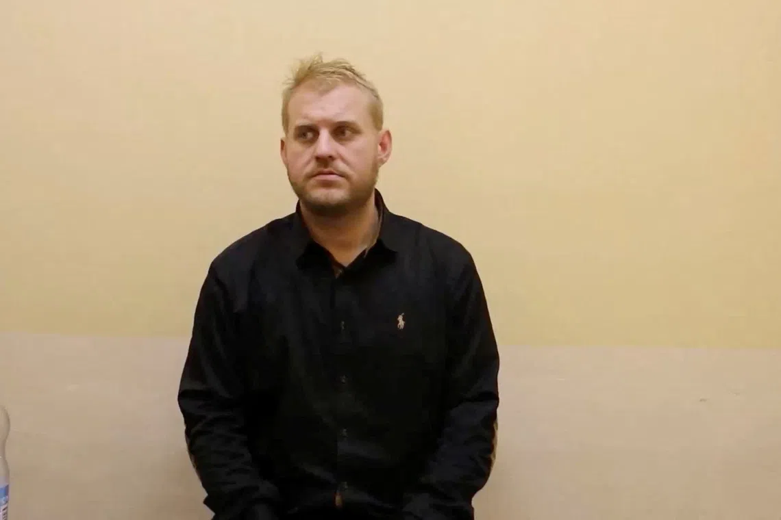 A Swedish national detained for illegally crossing Russia's border, according to the FSB security service, speaks at an unidentified location, in this still image from an FSB handout video released by Russian state media on October 15, 2026. Russian State Media/Handout via REUTERS