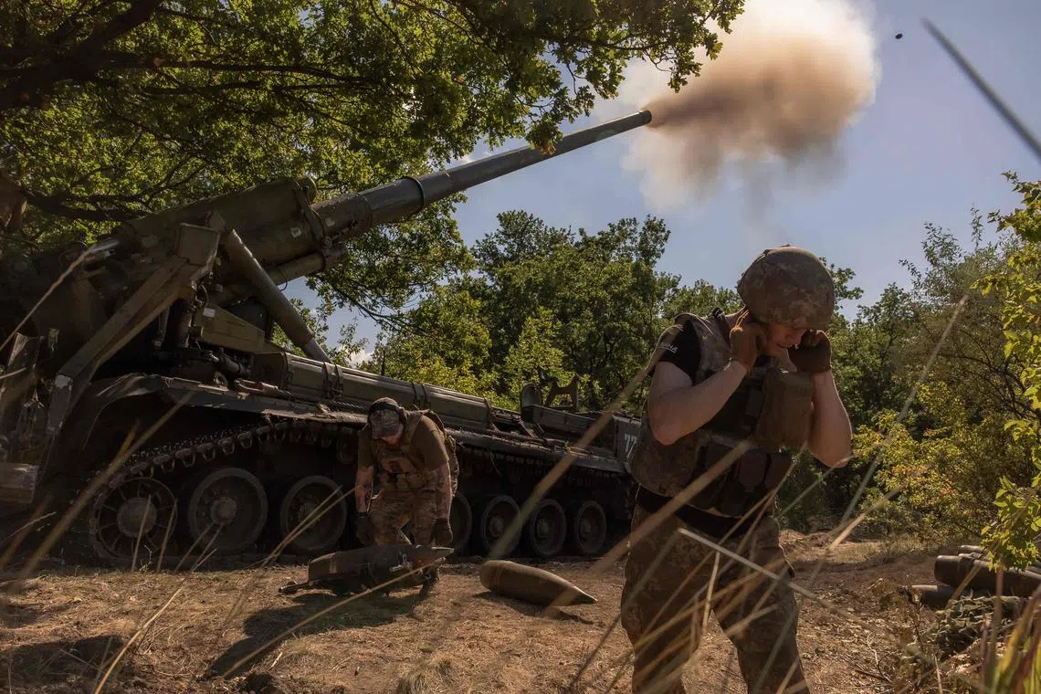 Ukrainian servicemen fire artillery towards Russian positions near Pokrovsk, in Ukraine's eastern Donetsk region.