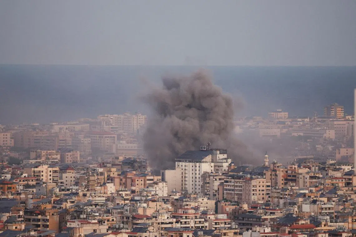 Smoke billowing over Beirut's southern suburbs after an Israeli strike on Oct 20.