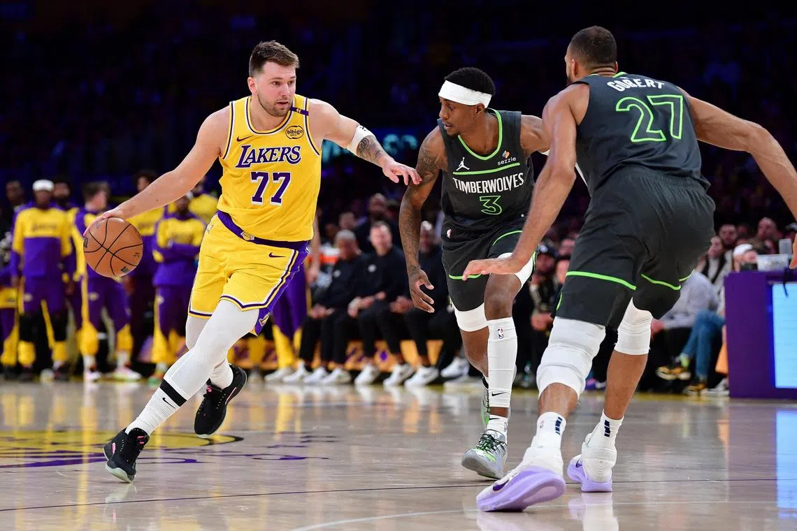 Los Angeles Lakers guard Luka Doncic moves the ball against Minnesota Timberwolves during the NBA play-offs last season.