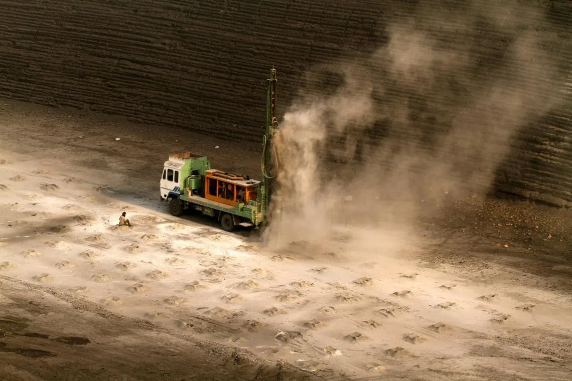 FILE PHOTO: A worker sits near a drilling machine at a coal mine in the Mahanadi coal fields at Dera, near Talcher town in the eastern Indian state of Orissa March 28, 2012. REUTERS/Rupak De Chowdhuri/File Photo