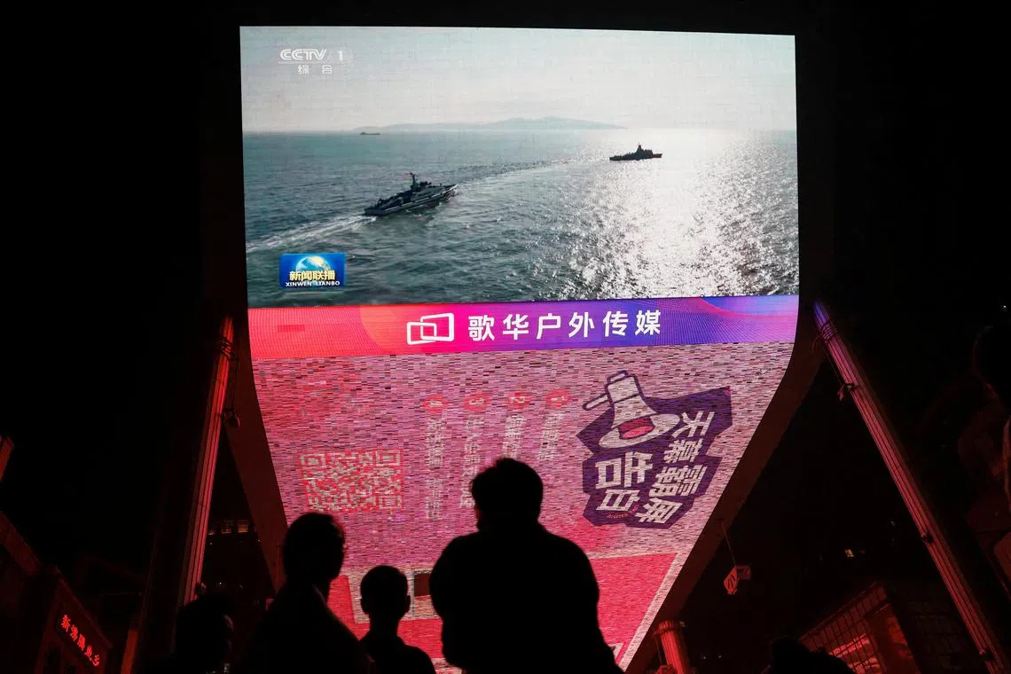 A news broadcast in Beijing on the People’s Liberation Army conducting drills in areas around Taiwan in October 2024. The new rules will take effect on March 1.