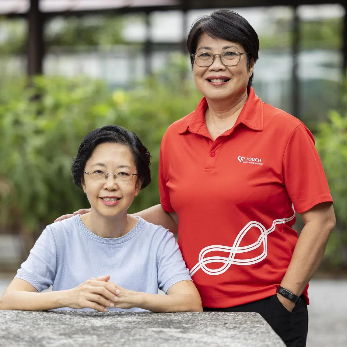 ST20241107_202473600457/thdonee//Brian Teo/Theresa Tan GM/(From Left) Profile of Ms Ng Siew Kueen, 54, trainer at a social service agency, and Ms Julia Lee, 61, group head of Touch Deputies and Donees at Touch Community Services, at the circular garden beside Block 525 Jurong West Street 52 on Nov 7, 2024. Ms Ng hired Ms Lee to be her professional donee. This allows Ms Lee to make decisions on Ms Ng's healthcare and finances in the event that she becomes mentally incapacitated. Ms Ng is part of a wider trend of Singaporeans hiring professionals to act on their behalf should they lose mental capacity. ST PHOTO: BRIAN TEO