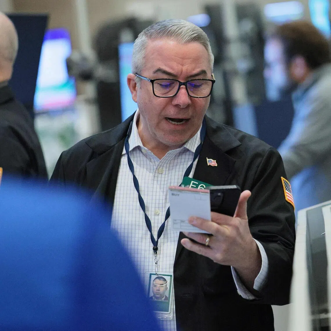 Traders working on the floor of the New York Stock Exchange during morning trading on April 8, in New York City. 