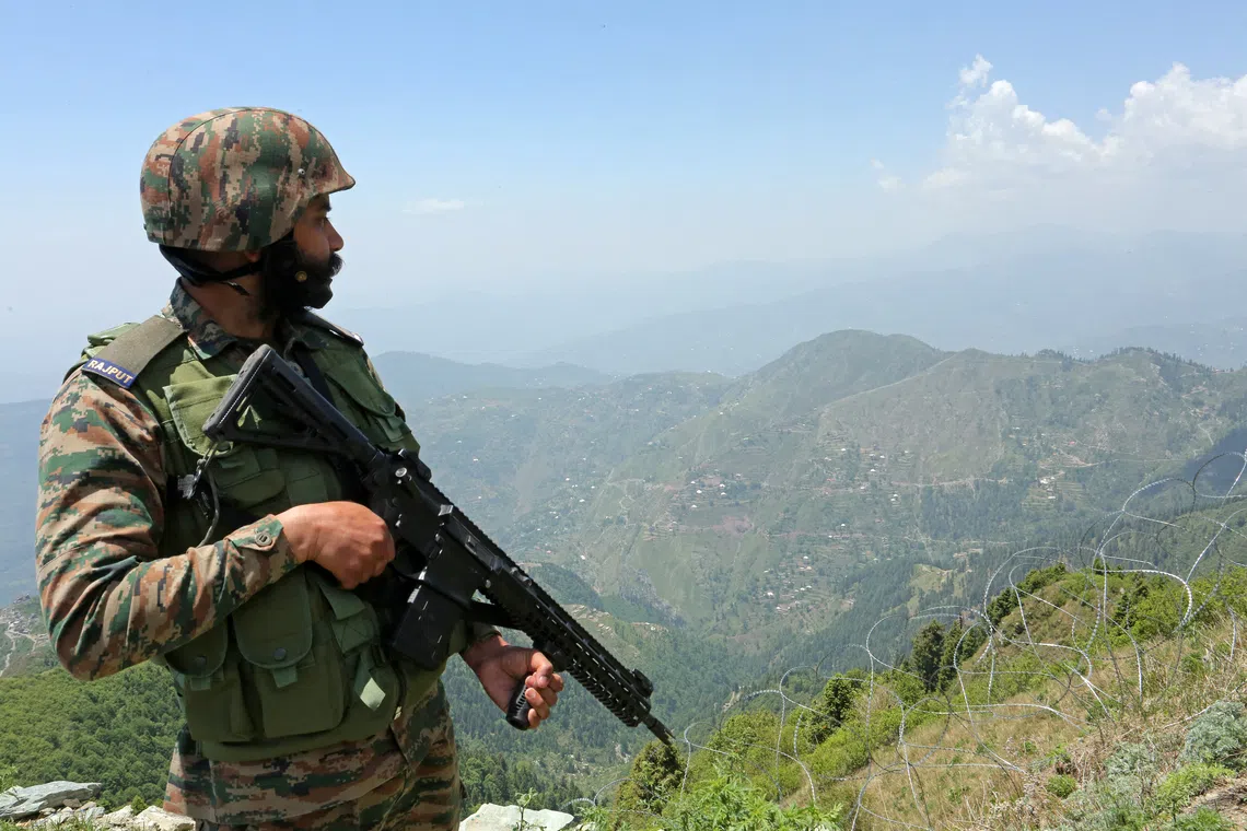 An Indian army soldier stands guard at the Line of Control between Pakistan and India, in Poonch sector of India’s Jammu region, on May 20, 2025.