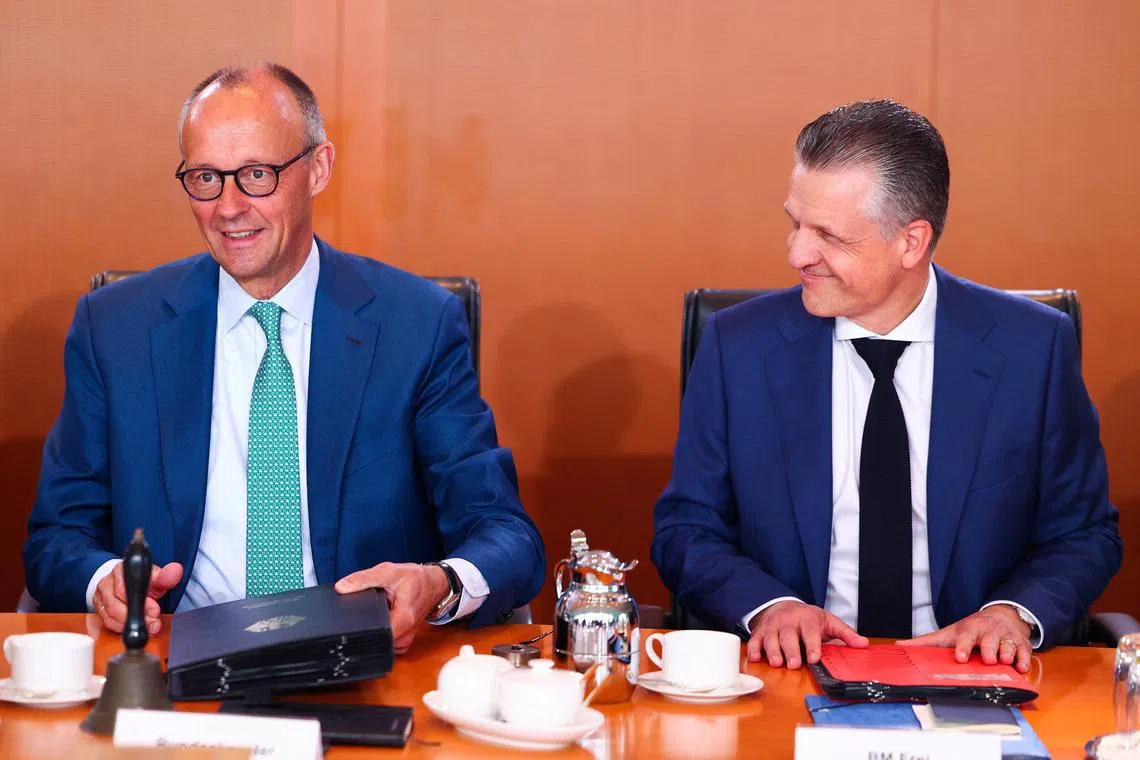 German Chancellor Friedrich Merz and Minister for Special Tasks and Head of the Federal Chancellery Thorsten Frei react at a cabinet meeting at the Chancellery in Berlin, Germany, July 22, 2026. REUTERS/Christian Mang