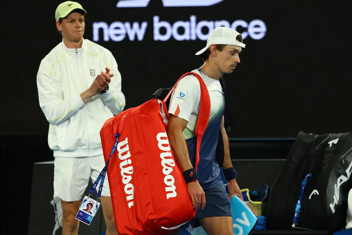 Italy's Jannik Sinner applauding as beaten quarter-finalist Alex de Minaur of Australia makes his exit on Jan 22.