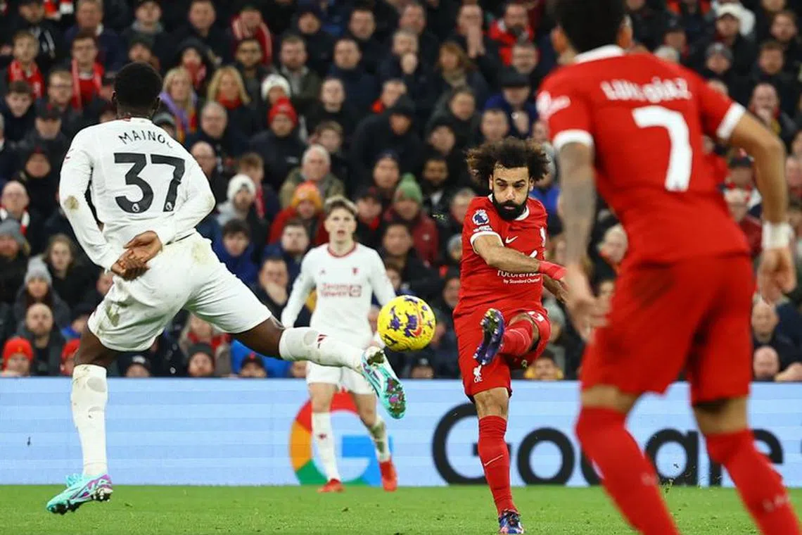 Soccer Football - Premier League - Liverpool v Manchester United - Anfield, Liverpool, Britain - December 17, 2023 Liverpool's Mohamed Salah shoots at goal REUTERS/Molly Darlington