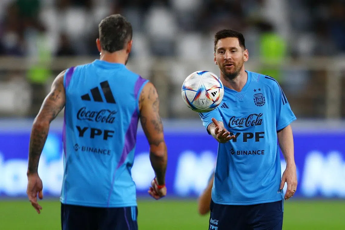 Argentina's Lionel Messi (right) during training at the Al Nahyan Stadium in Abu Dhabi on Nov 14, 2022.