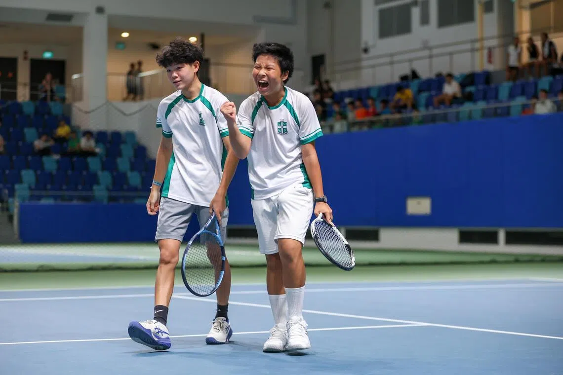 St Joseph's Institution's Noah Khoo (left) and Takuya Kaneko celebrate after winning the National School Games B Division Tennis Boys' Final at Kallang Tennis Hub on Mar 4.