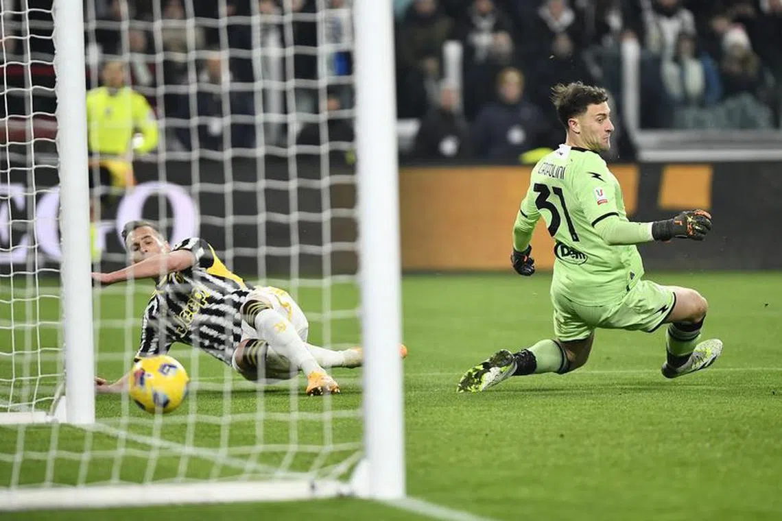 Soccer Football - Coppa Italia - Quarter Final - Juventus v Frosinone - Allianz Stadium, Turin, Italy - January 11, 2024 Juventus' Arkadiusz Milik scores their second goal past Frosinone's Michele Cerofolini REUTERS/Massimo Pinca