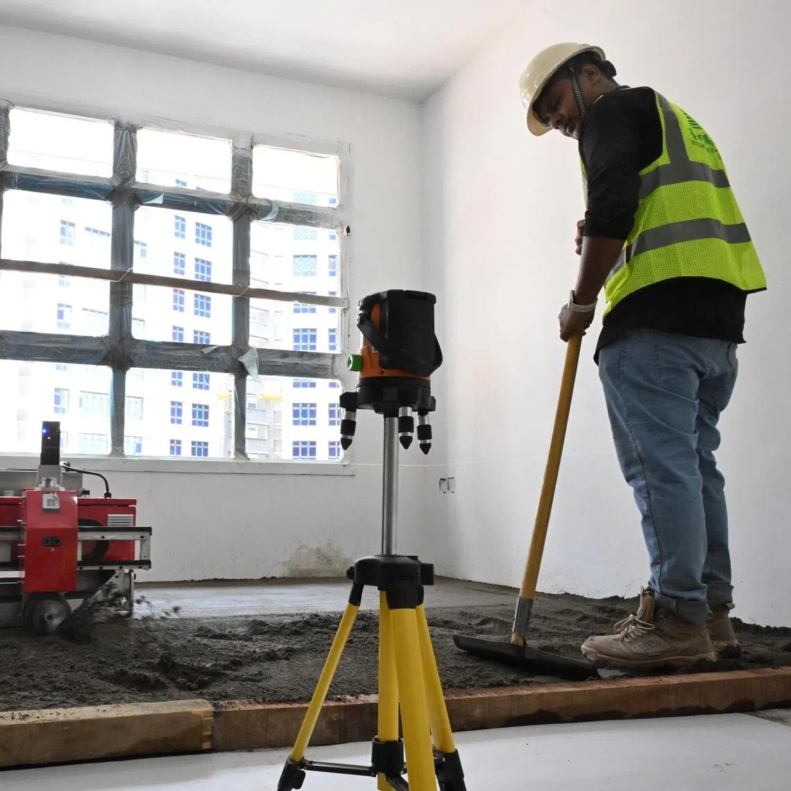 A screeding robot, guided by lasers, levelling and smoothing the floor surface during a demonstration at a construction site on Sept 21.
