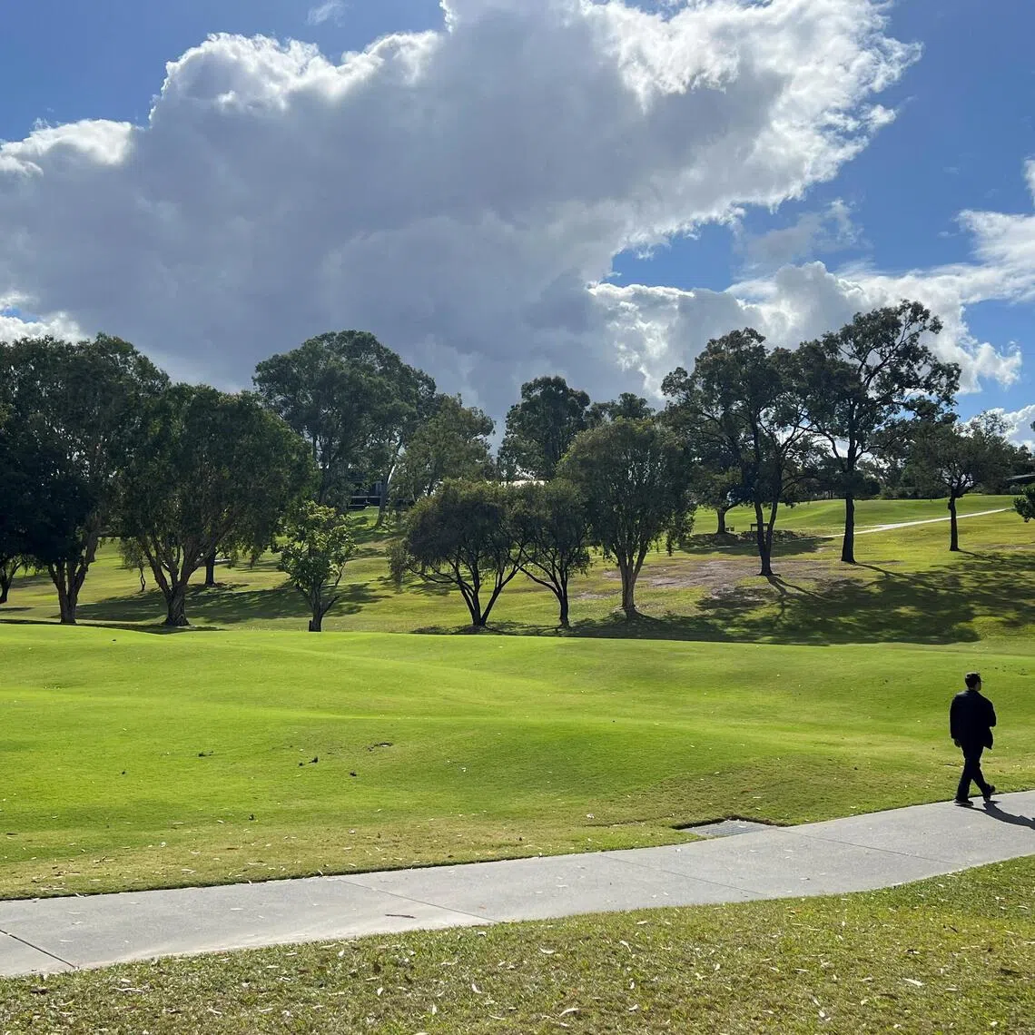 A man walks at the Victoria Park-Barrambin, where the main stadium will be built for the 2032 Olympics, in Brisbane, Australia on July 21, 2025.