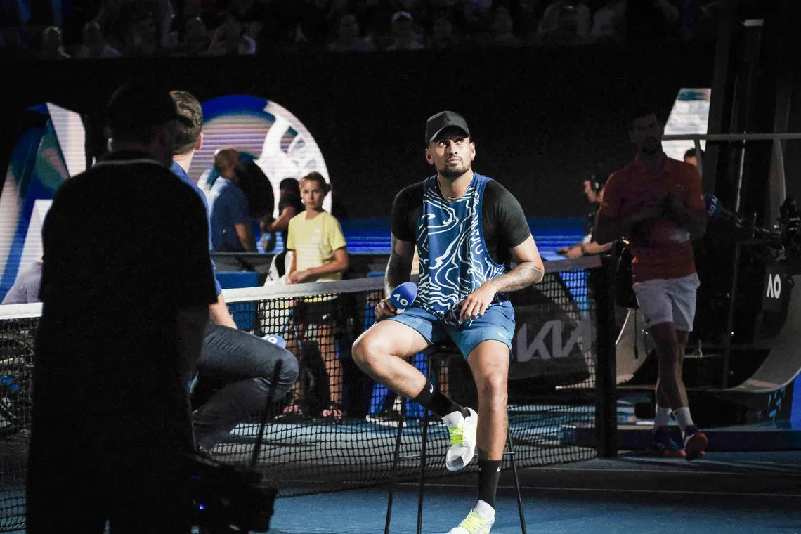 Nick Kyrgios participates in an interview following his showcase match against Novak Djokovic at Rod Laver Arena in Melbourne on Friday. 