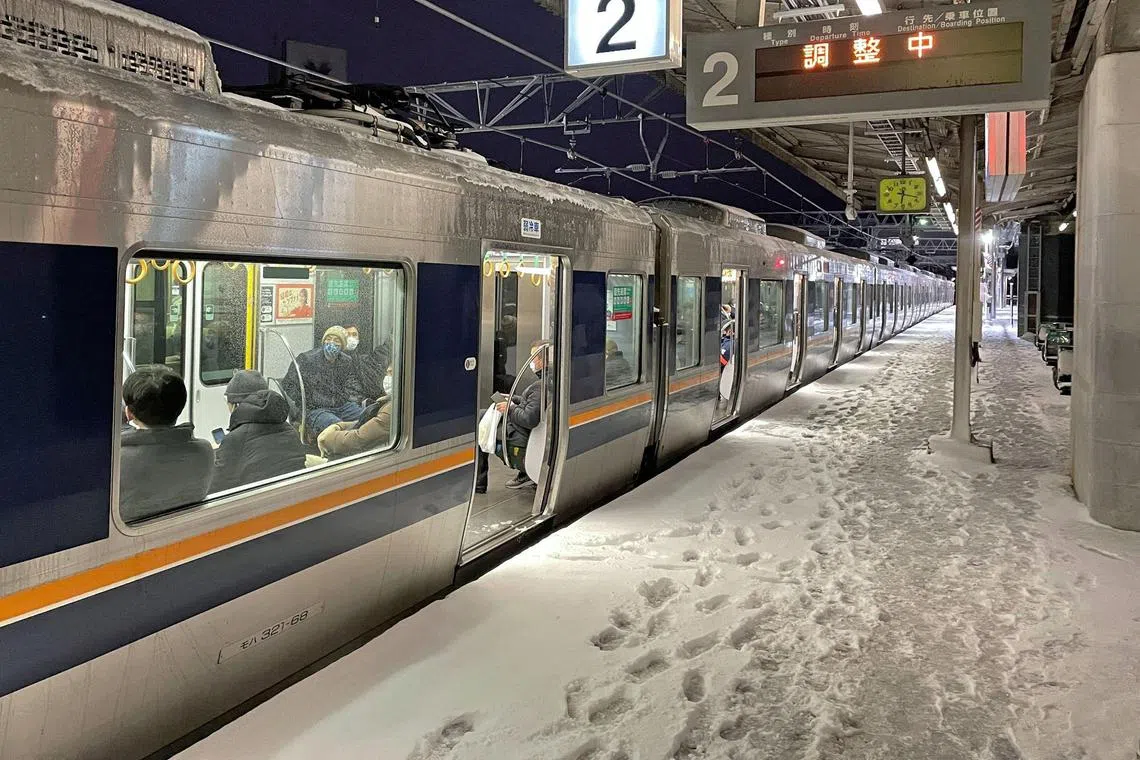 A train is stranded at Nishioji station in Kyoto, Japan in this photo provided by Kyodo on January 25, 2023. 