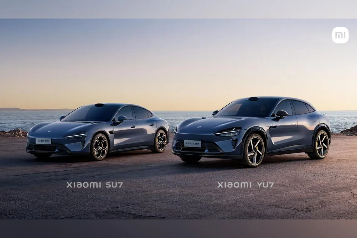 The YU7 parked beside Xiaomi's first electric vehicle, the SU7 sedan, with the two cars sporting similar designs.