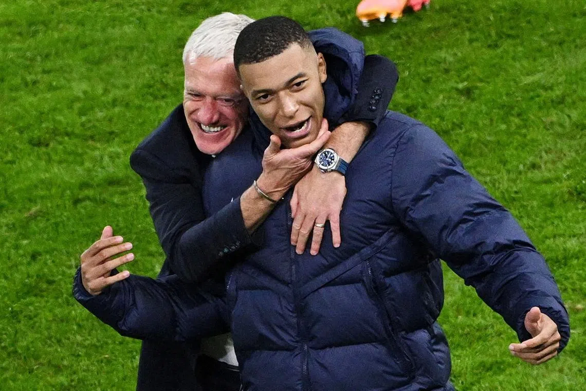 FILE PHOTO: Soccer Football - Euro 2024 - Quarter Final - Portugal v France - Hamburg Volksparkstadion, Hamburg, Germany - July 5, 2024 France coach Didier Deschamps celebrates with Kylian Mbappe after winning the penalty shootout REUTERS/Annegret Hilse/File Photo