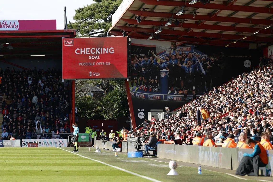 Soccer Football - FA Cup - Fifth Round - AFC Bournemouth v Wolverhampton Wanderers - Vitality Stadium, Bournemouth, Britain - March 1, 2025 A big screen displays a VAR review message Action Images via Reuters/Peter Cziborra