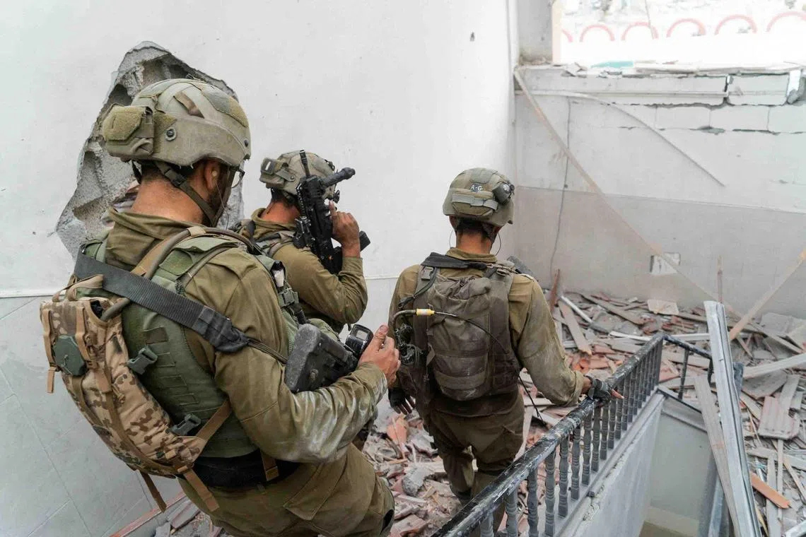 Israeli soldiers operate in the Gaza Strip, amid the army's ongoing operation against the Palestinian Islamist group Hamas.