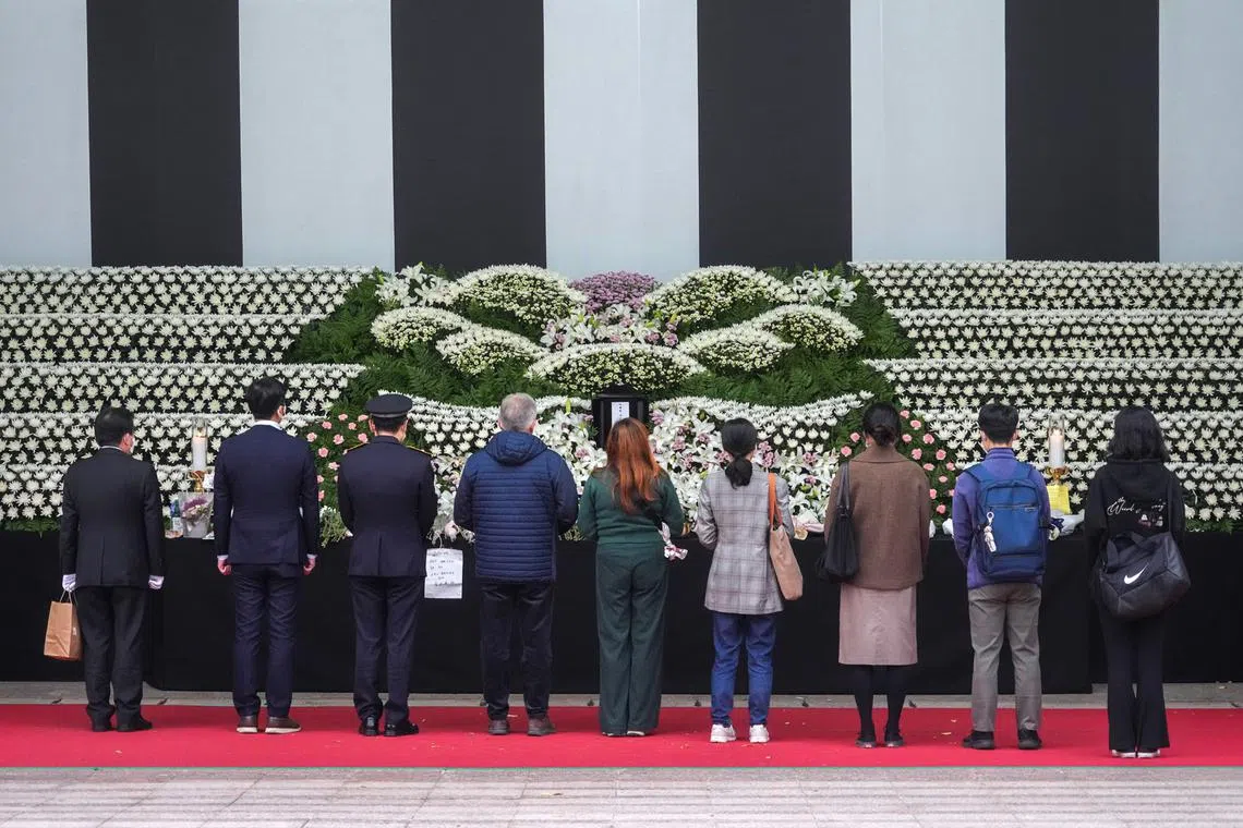Mourners visit a memorial at City Hall in Seoul on Oct. 31, 2022, in honour of the victims of the Halloween disaster. 