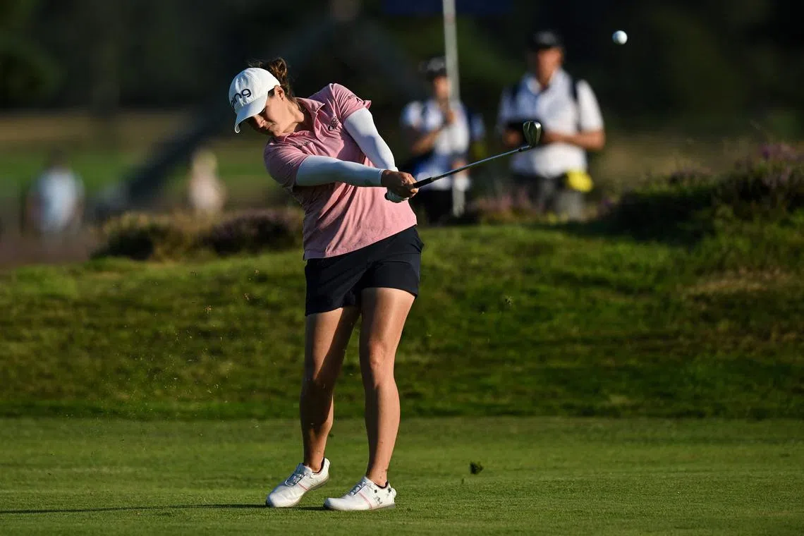 US golfer Ally Ewing plays a second shot from the 18th fairway on the opening day of the  Women's British Open.
