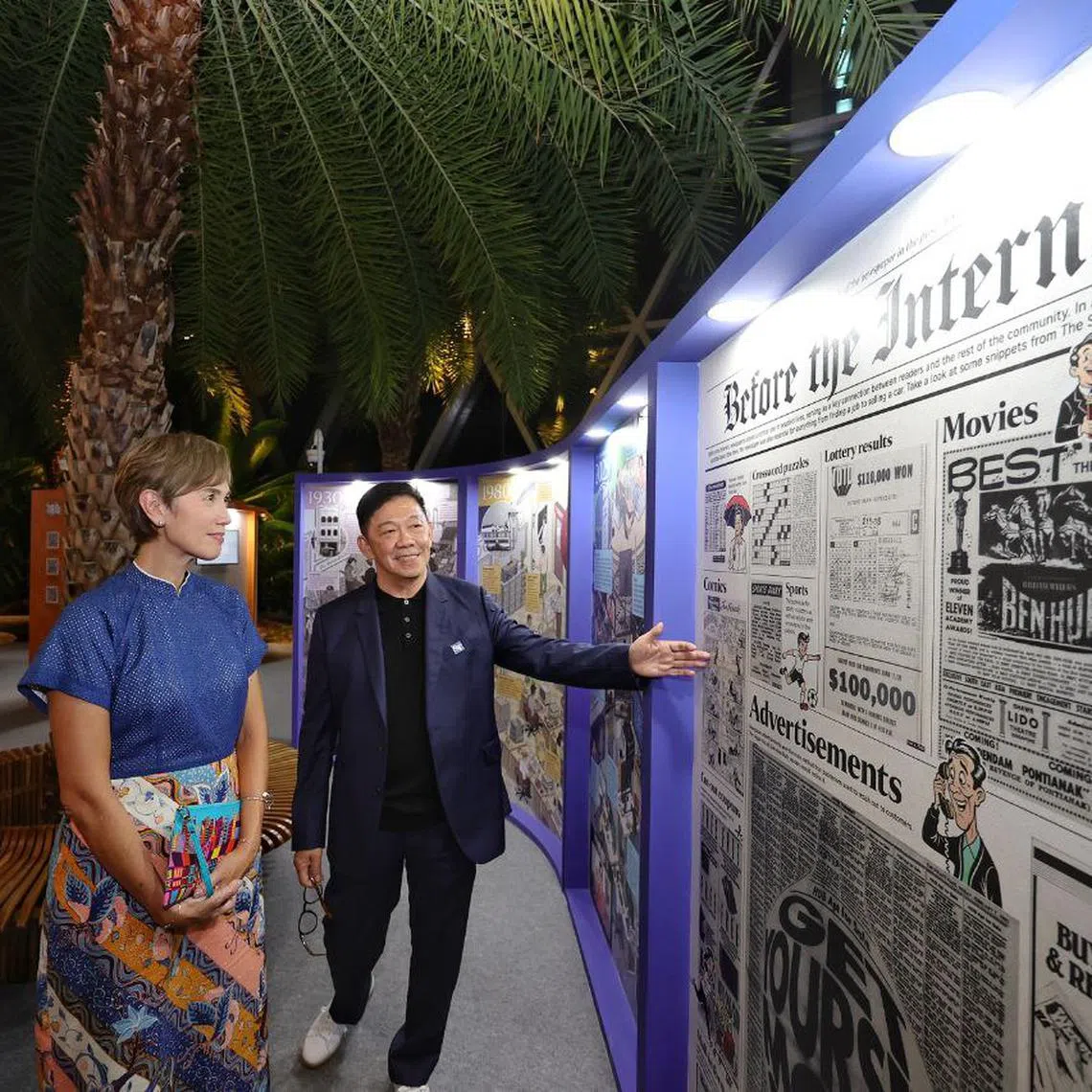 Minister for Digital Development and Information Josephine Teo, accompanied by ST's features editor Wong Kim Hoh and newsroom insights editor Diane Leow, touring Heartbeats And Headlines: 180 Years Of Telling The Singapore Story, an exhibition by ST to mark its 180th anniversary.