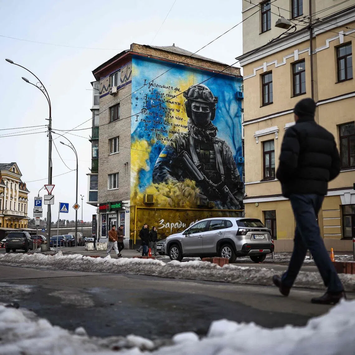 Street art in Ukraine's capital, Kyiv, on Feb 27, depicting a Ukrainian soldier with the colours of the Ukrainian flag, amid Russia's four-year invasion of the country.