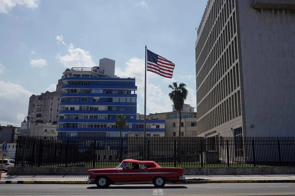 FILE PHOTO: A vintage car used for touristic city tours passes by the U.S. Embassy in Havana, Cuba, November 10, 2021. Photo taken on November 10, 2021. REUTERS/Alexandre Meneghini/File Photo