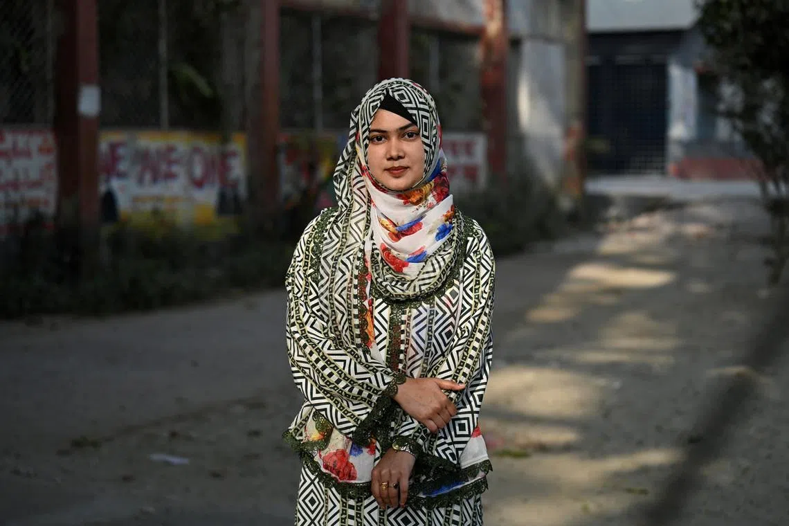 Monika Akter, 24, a job seeker and first-time voter, poses for a photograph at the Government Azizul Haque College campus in Bogura, Bangladesh, February 4, 2026. REUTERS/Fatima Tuj Johora