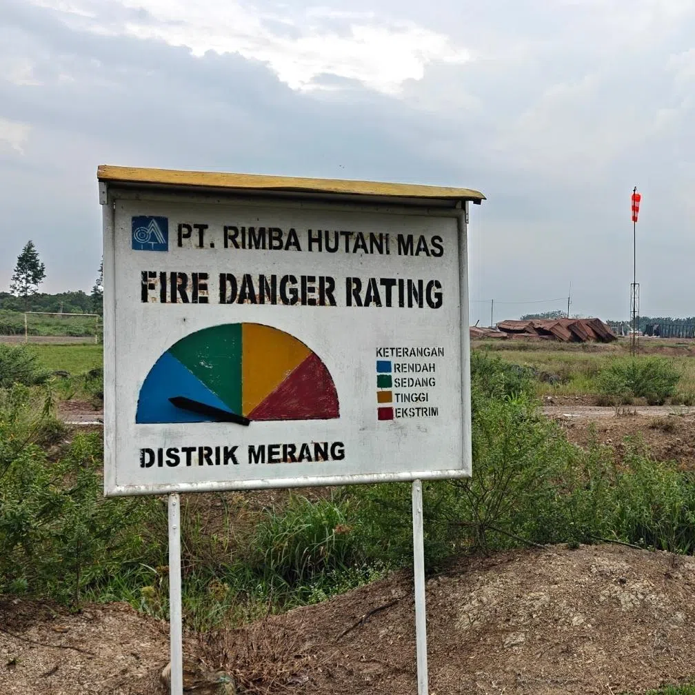 A signboard indicating the fire danger rating at the PT Rimba Hutani Mas concession in South Sumatra.