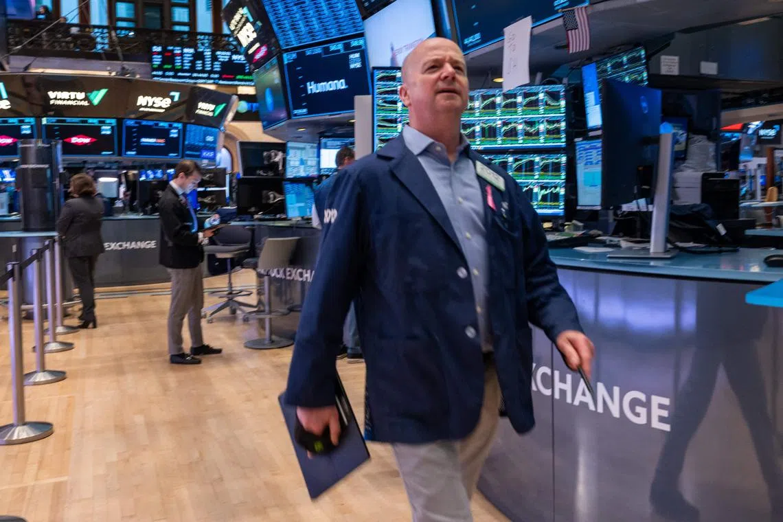 Traders work on the floor of the New York Stock Exchange, in New York City. 