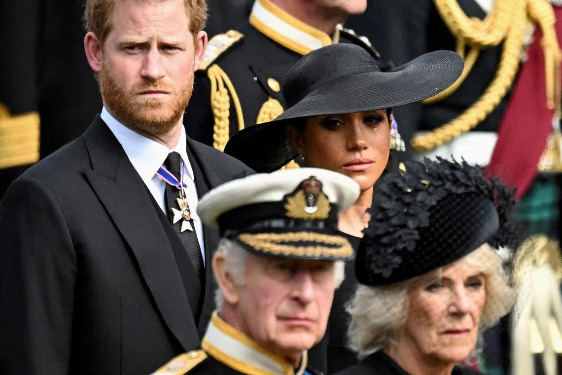 FILE PHOTO: Britain's Meghan, Duchess of Sussex, cries as she, Prince Harry, Duke of Sussex, Queen Camilla and King Charles attend the state funeral and burial of Britain's Queen Elizabeth, in London, Britain, September 19, 2022.       REUTERS/Toby Melville/File Photo