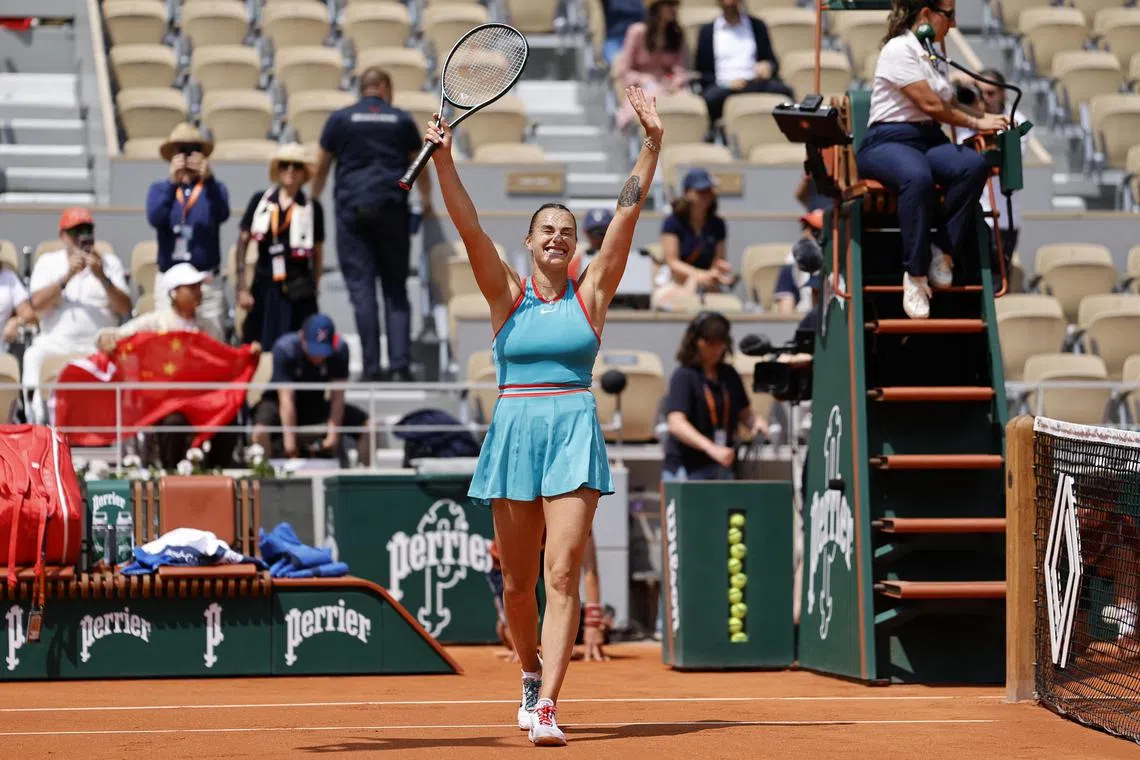 Belarus' Aryna Sabalenka celebrates after winning her French Open quarter-final match against China's Zheng Qinwen.