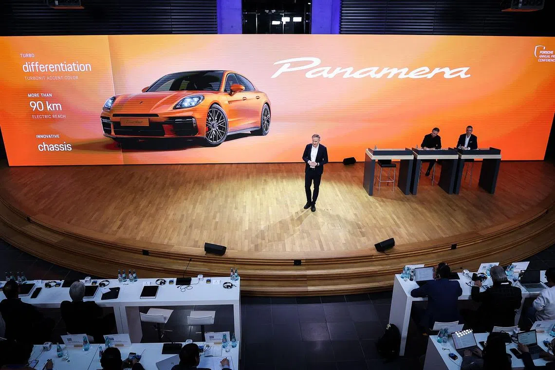 Oliver Blume, CEO of German car maker Porsche AG, addresses the company's annual press conference in Leipzig, eastern Germany, March 12, 2024. (Photo by RONNY HARTMANN / AFP)