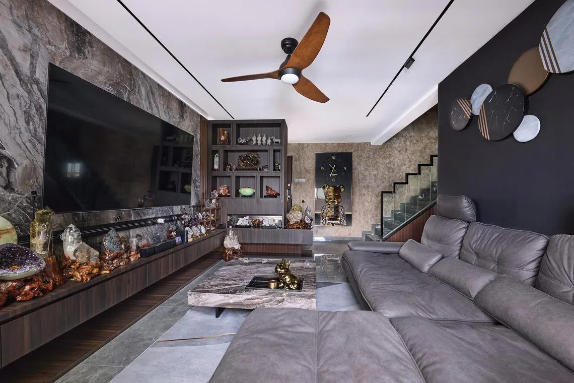 The living room of Mr David Ng's flat is where he spends the most time with his parents, who live with him.