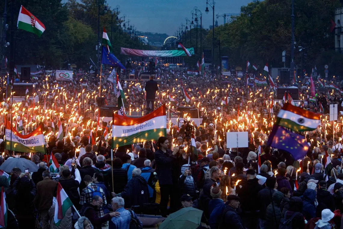 Leader of the opposition party TISZA (Respect and Freedom) Peter Magyar addressing participants at Heroes' Square in central Budapest on Oct 23, 2025, during an event commemorating the 69th anniversary of the Hungarian uprising against the Soviet occupation in 1956. 