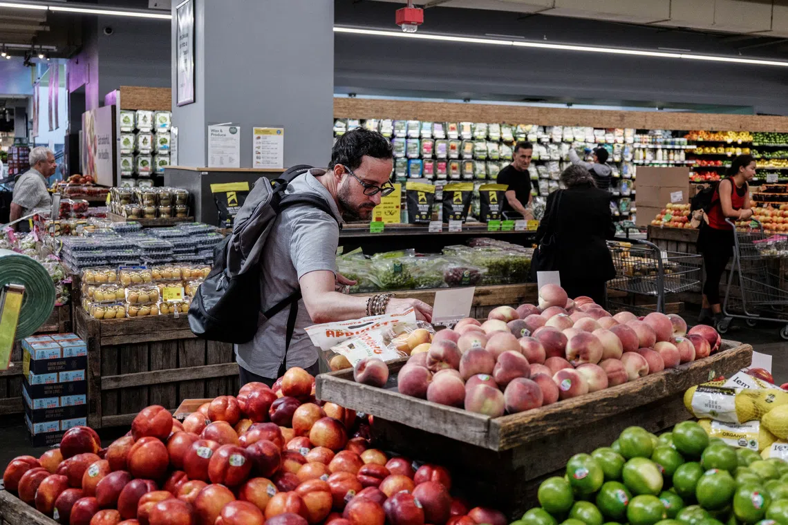 A person shops for groceries in New York City, U.S., July 15, 2025. REUTERS/Jeenah Moon