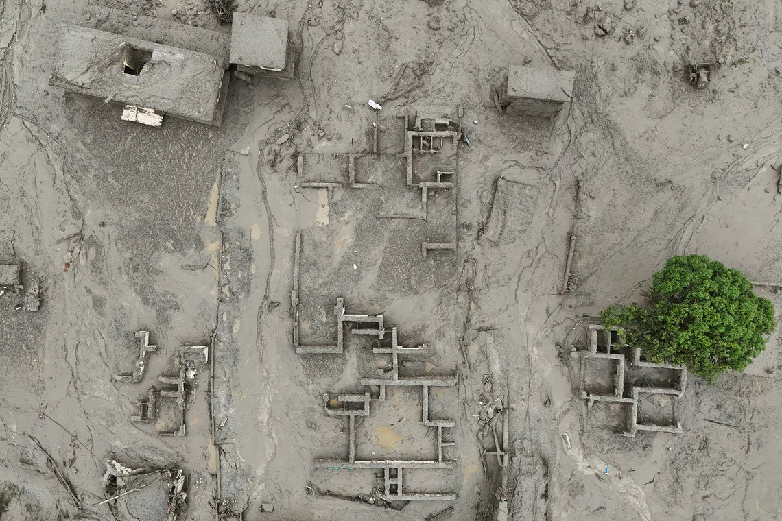 A drone view shows mud covering properties following a flash flood in Trishuli, Nuwakot district, Nepal, August 27, 2026. REUTERS/Navesh Chitrakar