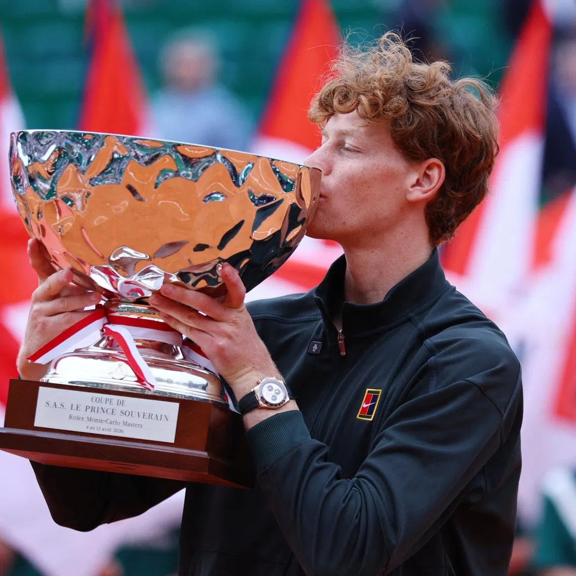 Tennis - ATP Masters 1000 - Monte Carlo Masters - Monte Carlo Country Club, Roquebrune-Cap-Martin, France - April 12, 2026 Italy's Jannik Sinner celebrates with the trophy after winning his final match against Spain's Carlos Alcaraz REUTERS/Manon Cruz