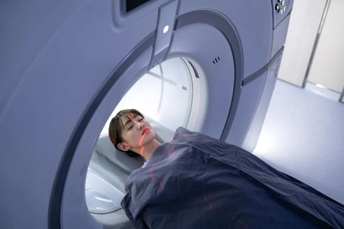 patient undergoing mri head scan for doctors to check cause of severe headaches