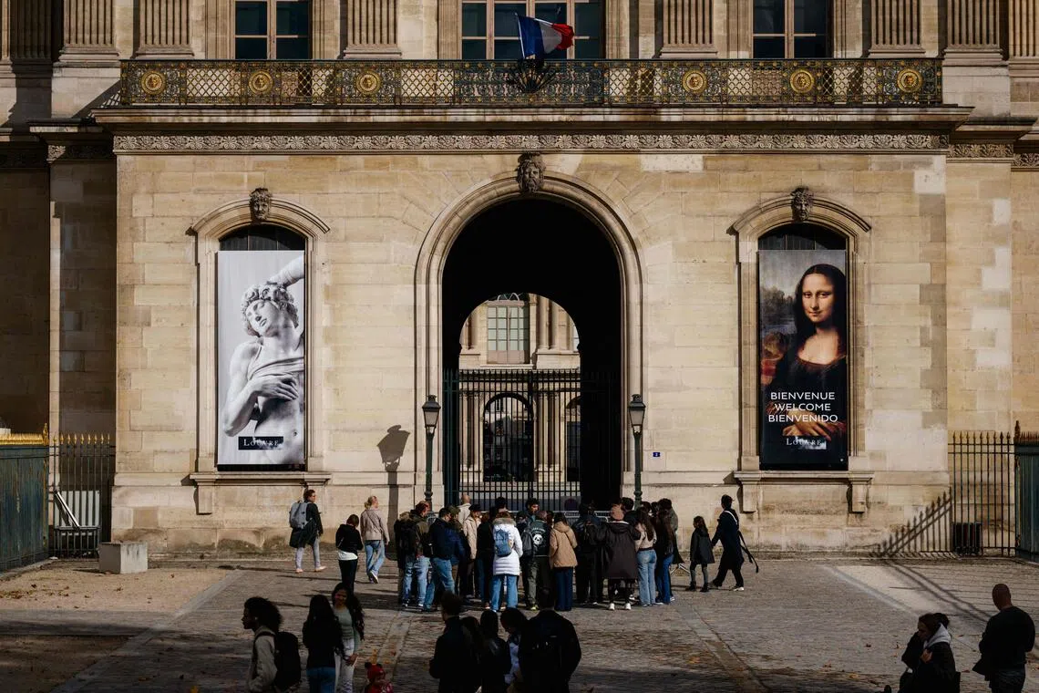 Tourists outside the Louvre on Oct 20, when it remained closed for a second day following a jewel heist.